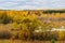 Picturesque autumn landscape. View from the hill to the lowland