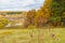 Picturesque autumn landscape. View from the hill to the lowland