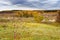 Picturesque autumn landscape. View from the hill to the lowland