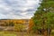 Picturesque autumn landscape. View from the hill to the lowland