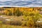 Picturesque autumn landscape. View from the hill to the lowland with forest and swamps. Beautiful natural background