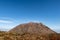 Picturesque autumn view of Unzen Nita Pass trail with rocky volcano peak, in Unzen-Amakusa National Park, Japan