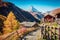 Picturesque autumn view of Zermatt village with Matterhorn Monte Cervino, Mont Cervin peak on backgroud. Beautiful outdoor scene