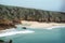 The picturesque beach in Cornwall, England, Porthcurno Beach.