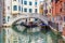 Picturesque canal with a gondola, Venice, Italy