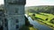 A picturesque castle against the landscape. River and lawn in front of Lismore Castle tower