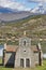 Picturesque chapel of Quintanilla in Riano mountain lake landscape. Spain