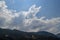 A picturesque cloud against the sun over the mountain. Turkish coast