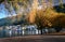 Picturesque coastal town with pebble pathway with yellow trees in autumn