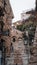 Picturesque cobblestone alleyway lined with stone buildings in Eze, France