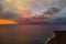 Picturesque colorful bright sunrise or sunset over Mediterranean Sea calm tranquil smooth waters. Fluffy clouds on morning or