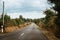 Picturesque country road in Normandy a cloudy day of summer