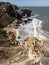 Picturesque Crimean landscape. Empty rocky beach and big waves at sea