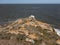 Picturesque Crimean seascape. Ancient settlement ruins on high cliffs over sea in sunny day