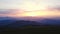 Picturesque dawn sunset sunrise mountain summit landscape bright sun sky horizon aerial static view