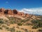 Picturesque desert scene with mountains, bushes, and clouds