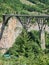 Picturesque Djurdzhevich Bridge. Montenegro. Reinforced concrete arch bridge over the Tara river.