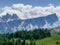 Picturesque Dolomite Alps formation Landscape photo with green spruces hill near Cinque Torri in South Tyrol, Italy. Beauty in