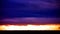 Picturesque dramatic panorama of sunset sky over dark flat skyline