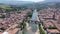 Picturesque drone view of Limoux summer cityscape looking out over ghotic cathedral on bank of river Aude , France