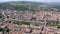 Picturesque drone view of Limoux summer cityscape looking out over ghotic cathedral on bank of river Aude , France