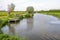 Picturesque Dutch landscape of a small river in summertime