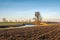 Picturesque Dutch polder landscape with a plowed field