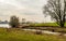 Picturesque Dutch river landscape with in the background castle