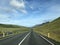 Picturesque empty road under a cloudy sky in Iceland