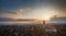 Picturesque epic backlit view of Siena Cathedral Santa Maria Assunta (Duomo) from Torre del Mangia tower at sunset golden hour,