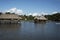 Picturesque and exotic lagoon with clean water El Milagro, loggon milagros with wooden house and thatched roof stilt houses Amazon