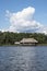 Picturesque and exotic lagoon with clean water El Milagro, loggon milagros with wooden house and thatched roof stilt houses Amazon