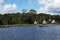 Picturesque and exotic lagoon with clean water El Milagro, loggon milagros with wooden house and thatched roof stilt houses Amazon