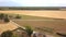 Picturesque farmhouse and barn in the middle of wheat field