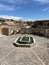 Picturesque fountain surrounded situated in the courtyard of an old building