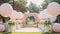 A picturesque garden wedding with pastel-colored balloons, creating a dreamy a