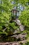 A picturesque gazebo on a rock in the park