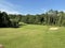 Picturesque golf hole with a pond