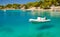 Picturesque gorgeous view of motorboat in a quiet bay of Milna on Brac island, Croatia