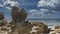 Picturesque granite boulders against a background of blue sky