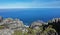 Picturesque gray spotted boulders against the backdrop of the blue Atlantic Ocean.