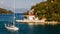 Picturesque Greece landscape with yacht during sunset. Wonderful colorful seascape