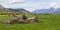 Picturesque green grass farmland landscape with snow top mountains, New Zealand