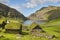 Picturesque green landscape with black houses in Faroe islands. Saksun