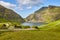 Picturesque green landscape with black houses in Faroe islands. Saksun