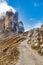 Picturesque hiking trail in Dolomite alps with a view of famous Tre Cime