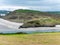 Picturesque hills in the south of Ireland, a view of the Clonakilty seashore. Cloudy, rainy weather. Landscapes along the Wild