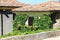 The picturesque house with flowers on the facade