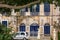 Picturesque house in Mdina, Malta, with navy blue door and windows shutters