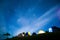 Picturesque illuminated tents under the starry night sky